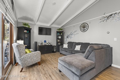 Tucked beneath a canopy of whispering trees, this modern chalet on Pocono Farms Country Club in Pennsylvania - for sale on GolfHomes.com, golf home, golf lot