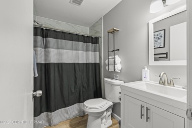 Tucked beneath a canopy of whispering trees, this modern chalet on Pocono Farms Country Club in Pennsylvania - for sale on GolfHomes.com, golf home, golf lot