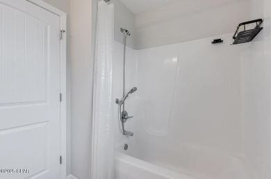 Beautiful corner lot home in Lynn Haven with detached on Panama Country Club in Florida - for sale on GolfHomes.com, golf home, golf lot