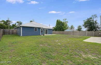 Beautiful corner lot home in Lynn Haven with detached on Panama Country Club in Florida - for sale on GolfHomes.com, golf home, golf lot