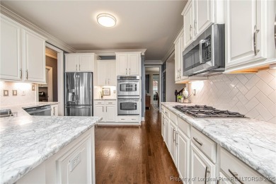 Southern charmer nestled on #2 fairway in King's Grant Golf & on Kings Grant Golf and Country Club in North Carolina - for sale on GolfHomes.com, golf home, golf lot