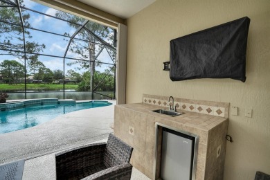 Stunning Pool Home on the Water in PGA Village! Beautifully on The Legacy Golf and Tennis Club in Florida - for sale on GolfHomes.com, golf home, golf lot