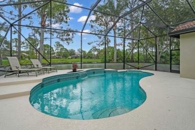 Stunning Pool Home on the Water in PGA Village! Beautifully on The Legacy Golf and Tennis Club in Florida - for sale on GolfHomes.com, golf home, golf lot