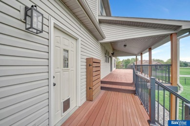 Nestled among the scenic Hi-Mark golf couse, this stunning on Pine Lake Golf and Tennis Club in Nebraska - for sale on GolfHomes.com, golf home, golf lot