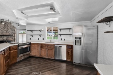 Welcome to 14702 Robin Ln, a spacious 4-bedroom, 2-bath home on Silver Lakes Golf Course in California - for sale on GolfHomes.com, golf home, golf lot