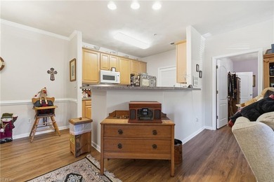 Second story condo with elevator. Covered balcony.  Large open on The Signature At West Neck in Virginia - for sale on GolfHomes.com, golf home, golf lot