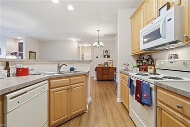 Second story condo with elevator. Covered balcony.  Large open on The Signature At West Neck in Virginia - for sale on GolfHomes.com, golf home, golf lot