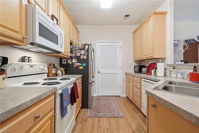 Second story condo with elevator. Covered balcony.  Large open on The Signature At West Neck in Virginia - for sale on GolfHomes.com, golf home, golf lot