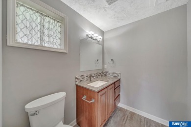 Nestled among the scenic Hi-Mark golf couse, this stunning on Pine Lake Golf and Tennis Club in Nebraska - for sale on GolfHomes.com, golf home, golf lot