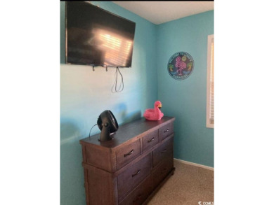 This great 4 bedroom, 3 bath cottage is one block from beach on The Dunes Golf and Beach Club in South Carolina - for sale on GolfHomes.com, golf home, golf lot