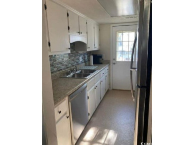 This great 4 bedroom, 3 bath cottage is one block from beach on The Dunes Golf and Beach Club in South Carolina - for sale on GolfHomes.com, golf home, golf lot