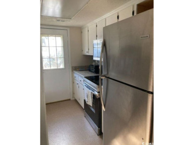 This great 4 bedroom, 3 bath cottage is one block from beach on The Dunes Golf and Beach Club in South Carolina - for sale on GolfHomes.com, golf home, golf lot