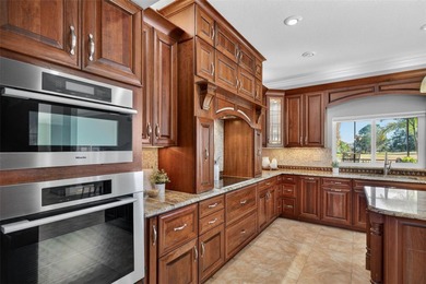 Stately golf course estate in the exclusive St. Andrews enclave on The Eagles Golf Course and Club in Florida - for sale on GolfHomes.com, golf home, golf lot