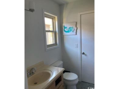 This great 4 bedroom, 3 bath cottage is one block from beach on The Dunes Golf and Beach Club in South Carolina - for sale on GolfHomes.com, golf home, golf lot