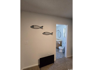 This great 4 bedroom, 3 bath cottage is one block from beach on The Dunes Golf and Beach Club in South Carolina - for sale on GolfHomes.com, golf home, golf lot