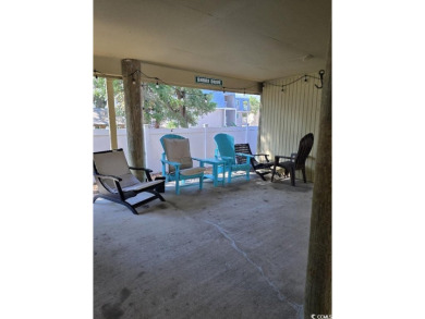 This great 4 bedroom, 3 bath cottage is one block from beach on The Dunes Golf and Beach Club in South Carolina - for sale on GolfHomes.com, golf home, golf lot