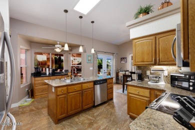 This home checks all the boxes! Total of 5 bedrooms, 4 baths, 3 on London Bridge Golf Course in Arizona - for sale on GolfHomes.com, golf home, golf lot
