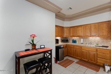 This home checks all the boxes! Total of 5 bedrooms, 4 baths, 3 on London Bridge Golf Course in Arizona - for sale on GolfHomes.com, golf home, golf lot