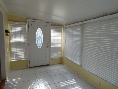 CALLING ALL FLIPPERS**LAKESIDE FIXER UPPER** NEEDS A/C AND A on Vista Plantation Golf Club in Florida - for sale on GolfHomes.com, golf home, golf lot