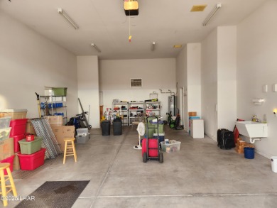 This home checks all the boxes! Total of 5 bedrooms, 4 baths, 3 on London Bridge Golf Course in Arizona - for sale on GolfHomes.com, golf home, golf lot