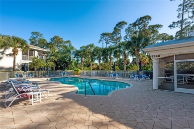 Experience luxury living in this spacious second-floor end unit on Naples Lakes Country Club in Florida - for sale on GolfHomes.com, golf home, golf lot