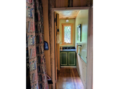This impeccably maintained, climate-controlled, historic Log on Lucerne In Maine Golf Course in Maine - for sale on GolfHomes.com, golf home, golf lot