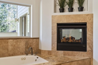 Nestled on a rare double 1/2 acre+ lot overlooking the 16th on Sunriver Woodlands Golf Course in Oregon - for sale on GolfHomes.com, golf home, golf lot
