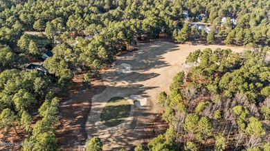 Experience resort-style living every day in this immaculate on Forest Creek Golf Club  in North Carolina - for sale on GolfHomes.com, golf home, golf lot