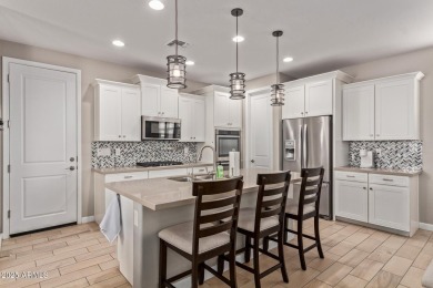 Enjoy the best of 55+ living in this charming single-level home on Verrado Golf Club - Victory in Arizona - for sale on GolfHomes.com, golf home, golf lot