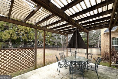 This beautiful, custom built Ranch is located in the Lake Dow on Canongate At Georgia National Golf Club in Georgia - for sale on GolfHomes.com, golf home, golf lot