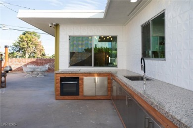 This exquisitely renovated home is the epitome of mid-century on Las Vegas National Golf Club in Nevada - for sale on GolfHomes.com, golf home, golf lot