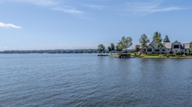 Experience panoramic views of Lake Oconee from this stunning on The Golf Club at Cuscowilla in Georgia - for sale on GolfHomes.com, golf home, golf lot