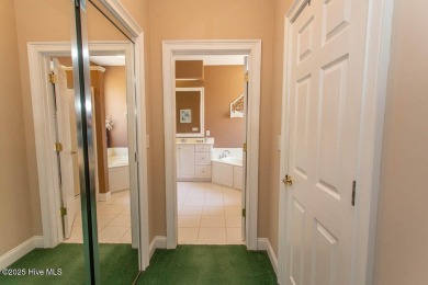 Gorgeous low-maintenance brick home backing up to the par 5 16th on Ocean Ridge Plantation in North Carolina - for sale on GolfHomes.com, golf home, golf lot