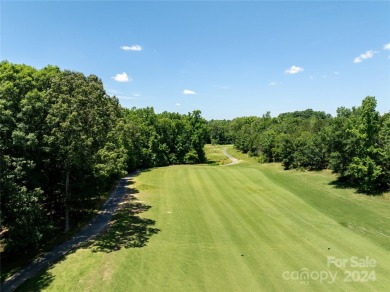 Stunning half acre homesite that backs up to the first hole of on The Palisades Country Club in North Carolina - for sale on GolfHomes.com, golf home, golf lot