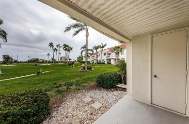 This ground-floor condo with 2 bedrooms and 2 bathrooms embodies on Isla Del Sol Yacht and Country Club in Florida - for sale on GolfHomes.com, golf home, golf lot