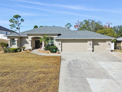Experience timeless design, modern upgrades, and effortless on Oak Hills Country Club in Florida - for sale on GolfHomes.com, golf home, golf lot