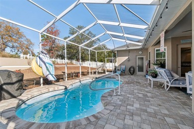 Experience timeless design, modern upgrades, and effortless on Oak Hills Country Club in Florida - for sale on GolfHomes.com, golf home, golf lot