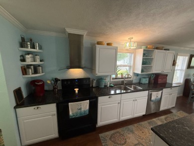 This well cared for home is being sold unfurnished.  As you on Del Tura Golf and Country Club in Florida - for sale on GolfHomes.com, golf home, golf lot