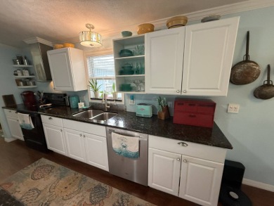 This well cared for home is being sold unfurnished.  As you on Del Tura Golf and Country Club in Florida - for sale on GolfHomes.com, golf home, golf lot