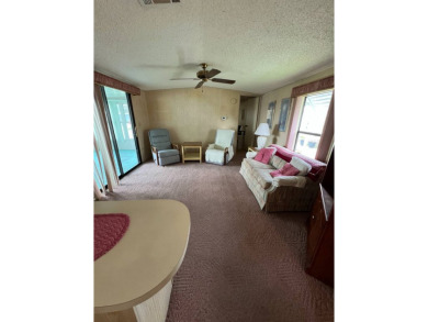 Charming home located in highly sought after Hidden Golf Club on Lake Henry Golf Club in Florida - for sale on GolfHomes.com, golf home, golf lot