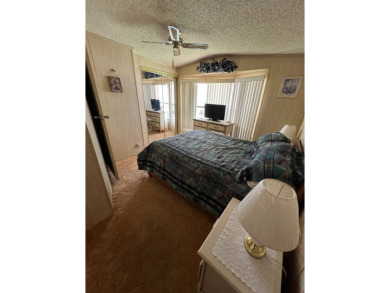 Charming home located in highly sought after Hidden Golf Club on Lake Henry Golf Club in Florida - for sale on GolfHomes.com, golf home, golf lot