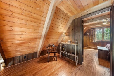 Impressively updated and meticulously maintained A-frame on Voyager Village Country Club - Voyager in Wisconsin - for sale on GolfHomes.com, golf home, golf lot