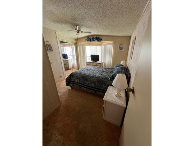 Charming home located in highly sought after Hidden Golf Club on Lake Henry Golf Club in Florida - for sale on GolfHomes.com, golf home, golf lot