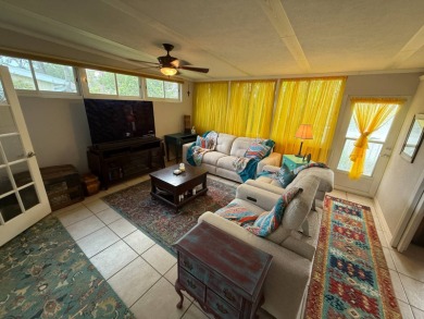 This well cared for home is being sold unfurnished.  As you on Del Tura Golf and Country Club in Florida - for sale on GolfHomes.com, golf home, golf lot