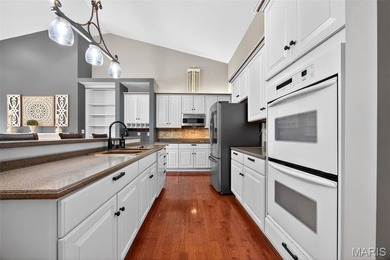 Experience elegant living in this stunning villa located in the on Winghaven Country Club in Missouri - for sale on GolfHomes.com, golf home, golf lot