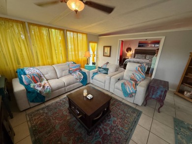 This well cared for home is being sold unfurnished.  As you on Del Tura Golf and Country Club in Florida - for sale on GolfHomes.com, golf home, golf lot