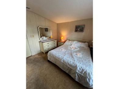 Charming home located in highly sought after Hidden Golf Club on Lake Henry Golf Club in Florida - for sale on GolfHomes.com, golf home, golf lot