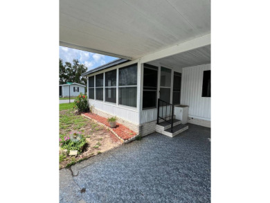 Charming home located in highly sought after Hidden Golf Club on Lake Henry Golf Club in Florida - for sale on GolfHomes.com, golf home, golf lot
