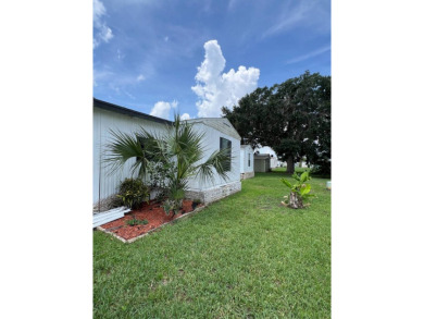 Charming home located in highly sought after Hidden Golf Club on Lake Henry Golf Club in Florida - for sale on GolfHomes.com, golf home, golf lot