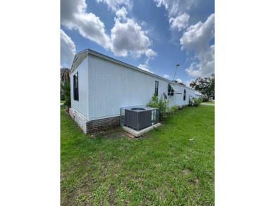 Charming home located in highly sought after Hidden Golf Club on Lake Henry Golf Club in Florida - for sale on GolfHomes.com, golf home, golf lot